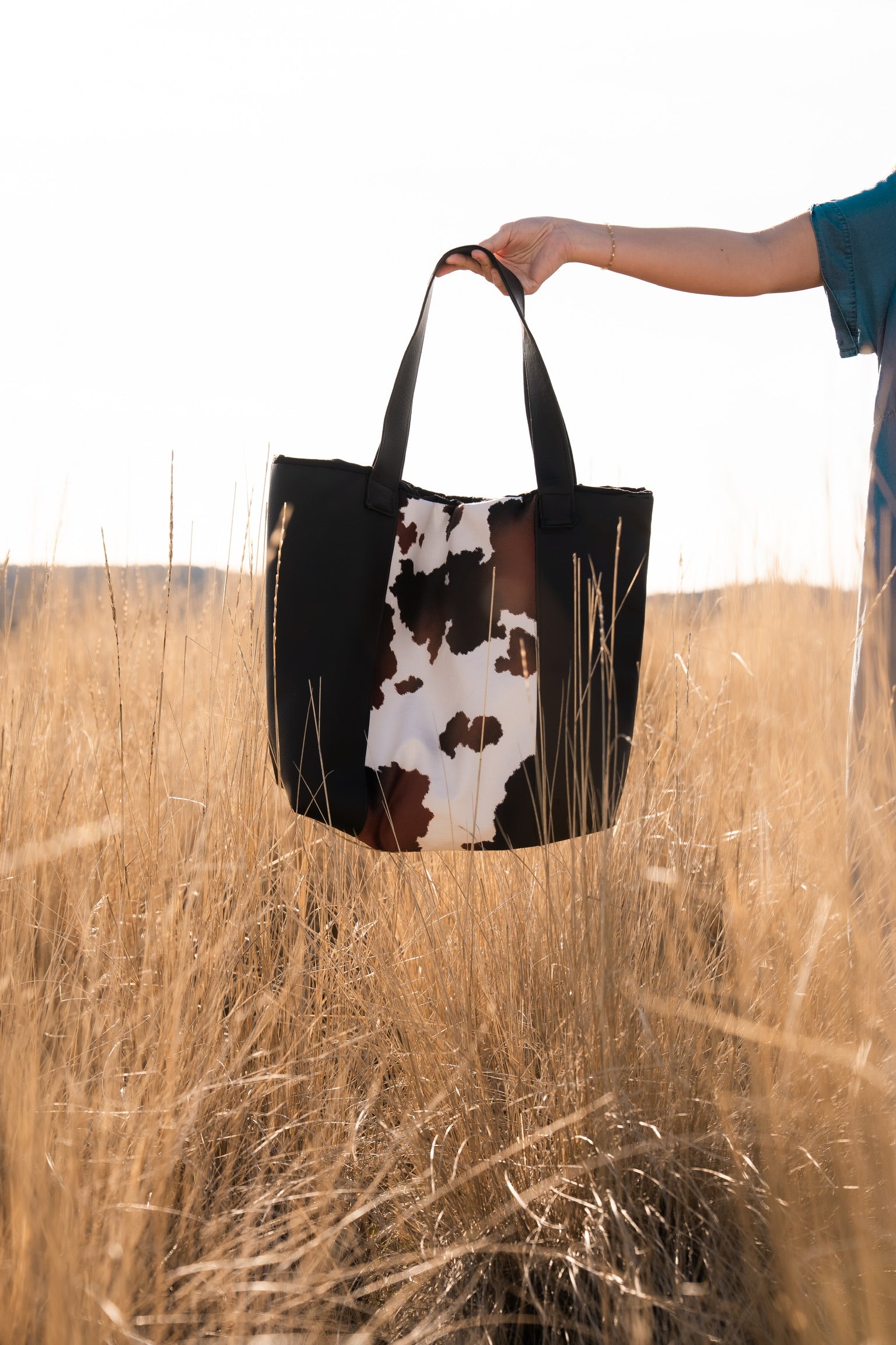 Two Toned Black Leather and Cow Print Tote Bag